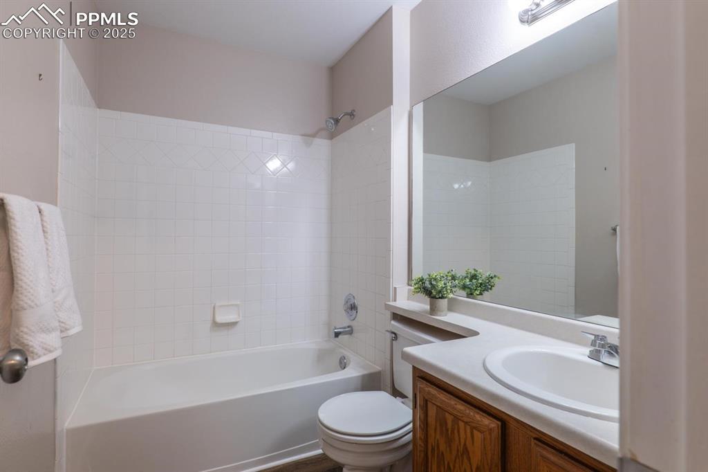 Image 16 of 26: 2nd main level full bathroom with luxury vinyl plank flooring.