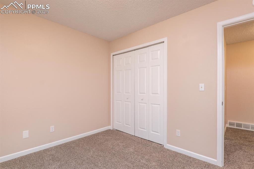 Image 18 of 26: 3rd main level bedroom.