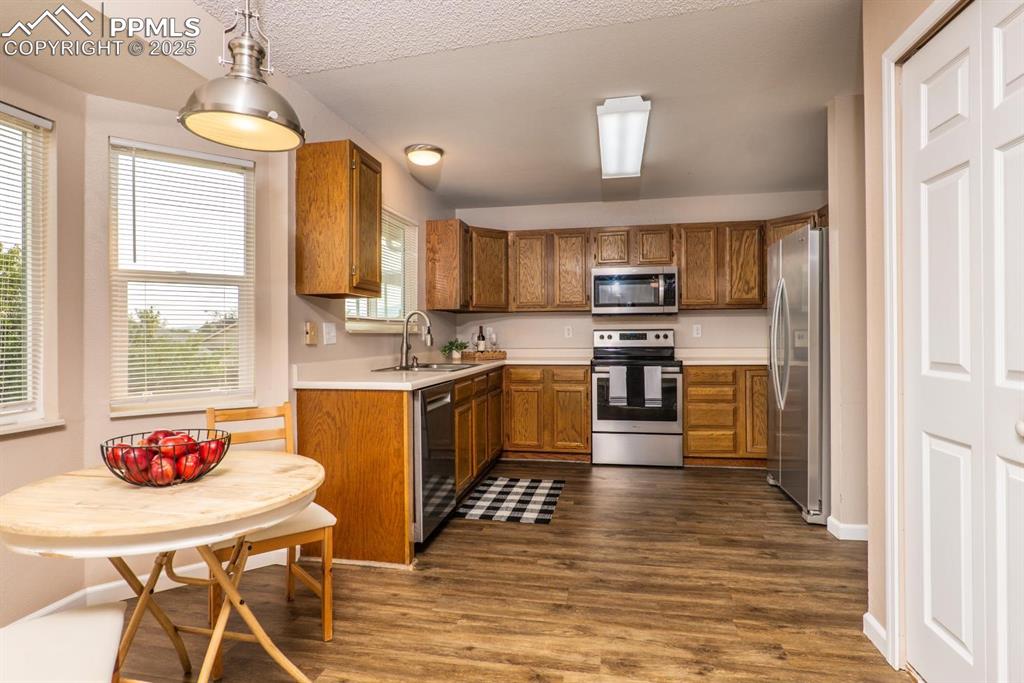 Image 4 of 26: The spacious kitchen is a chef’s delight with stainless steel appliances, a