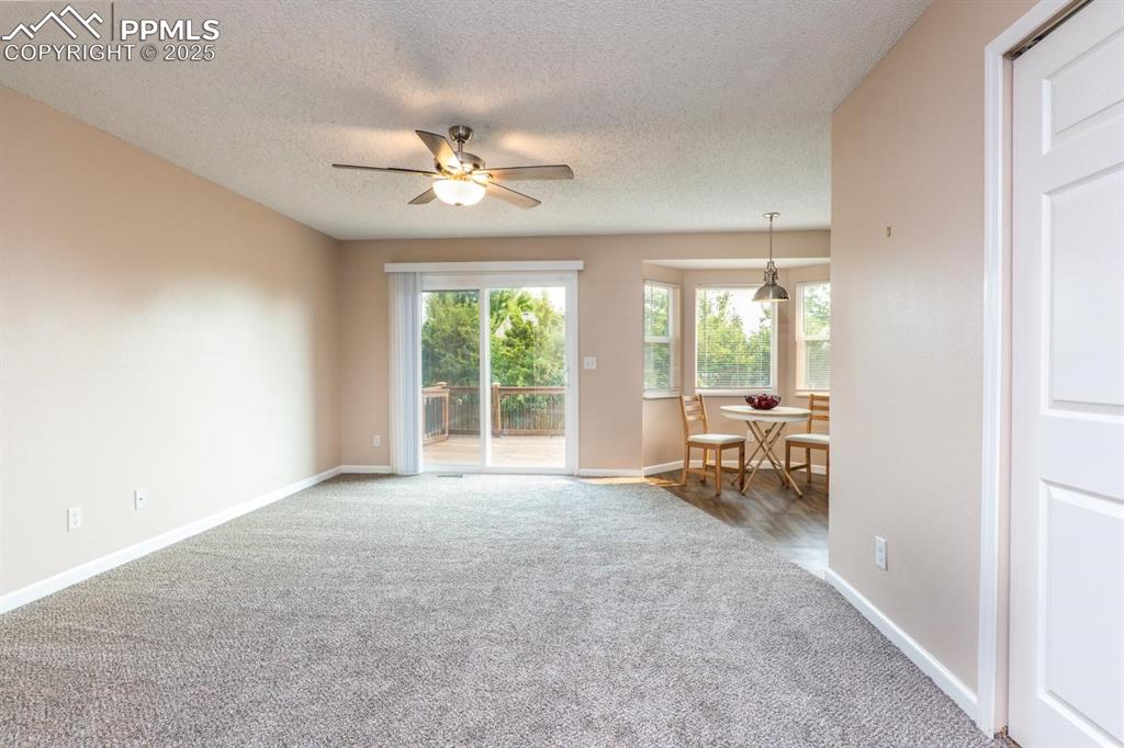 Image 8 of 26: Stay cool on warm days with A/C or the light breeze from the ceiling fan. W