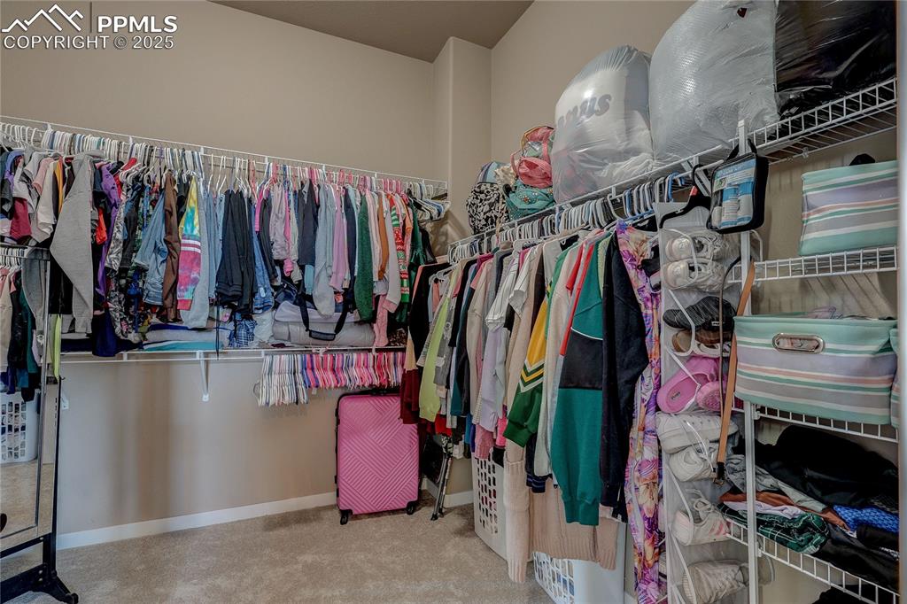 Image 24 of 49: Primary Walkin Closet