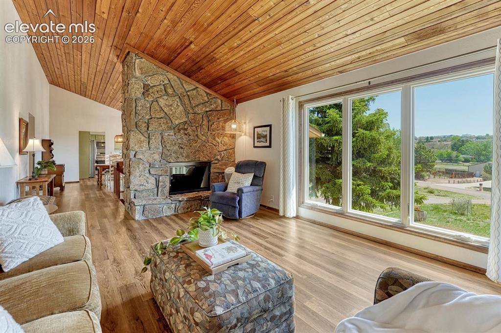 Image 11 of 50: Stunning natural stone fireplace emits passive heating, even when not in us