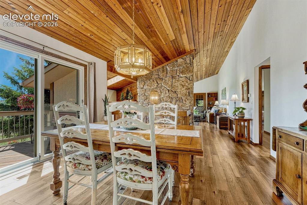 Image 12 of 50: Dining room opens to deck
