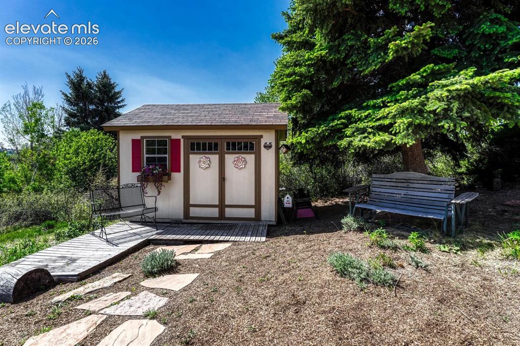 Image 48 of 50: Outdoor shed for extra storage