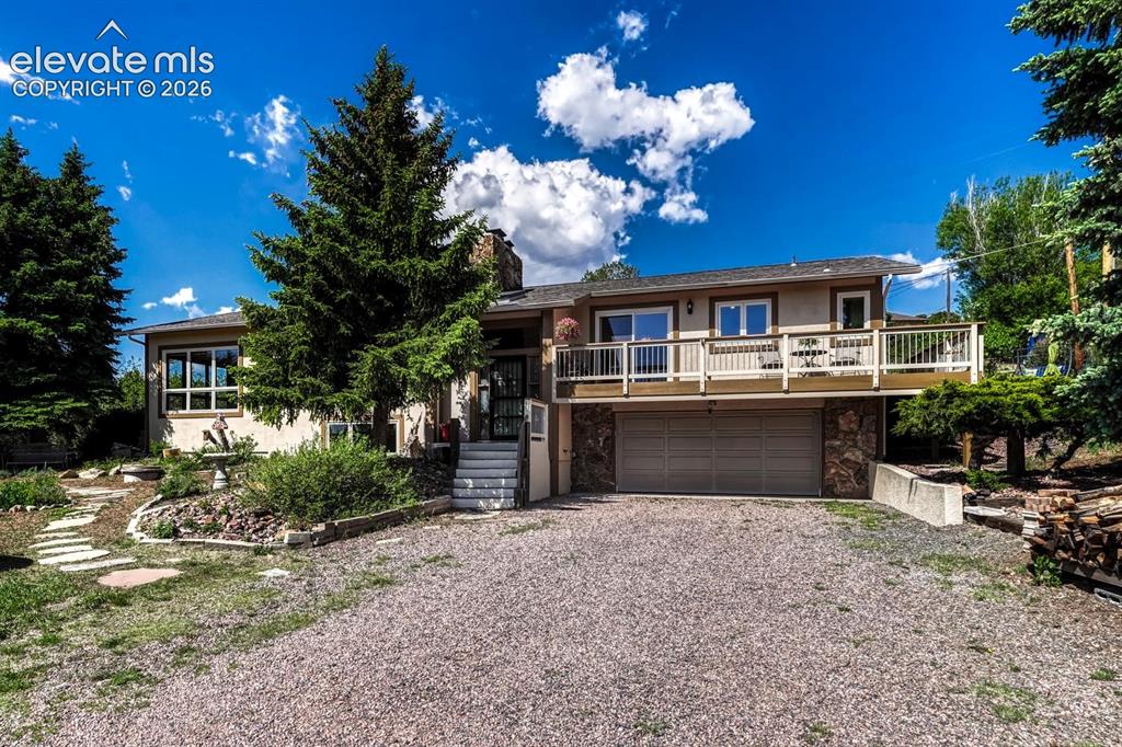 Image 6 of 50: Space for RV parking! Oversized garage has ample lighting and electric serv