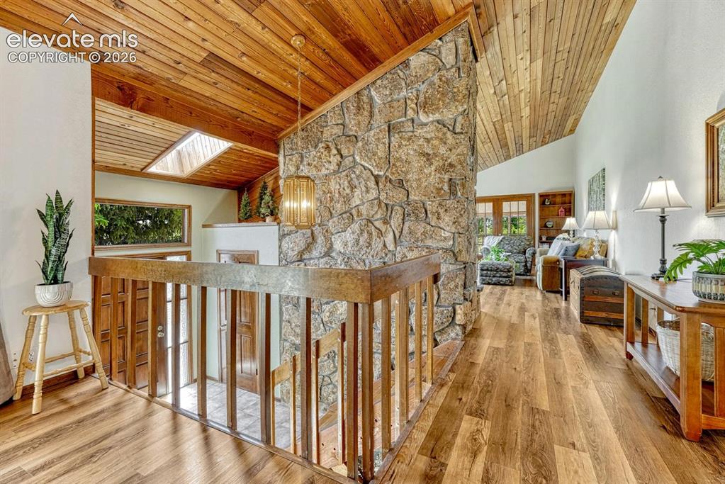 Image 7 of 50: Open-riser staircase with wood treads