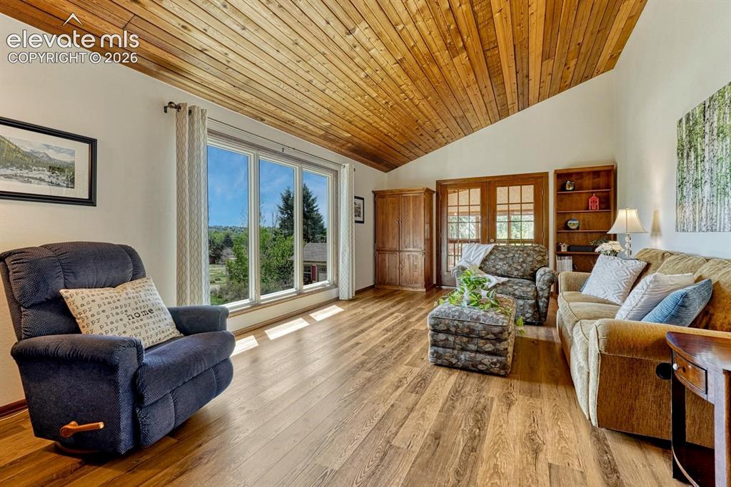 Image 9 of 50: Vaulted wood ceiling elevates the main living areas