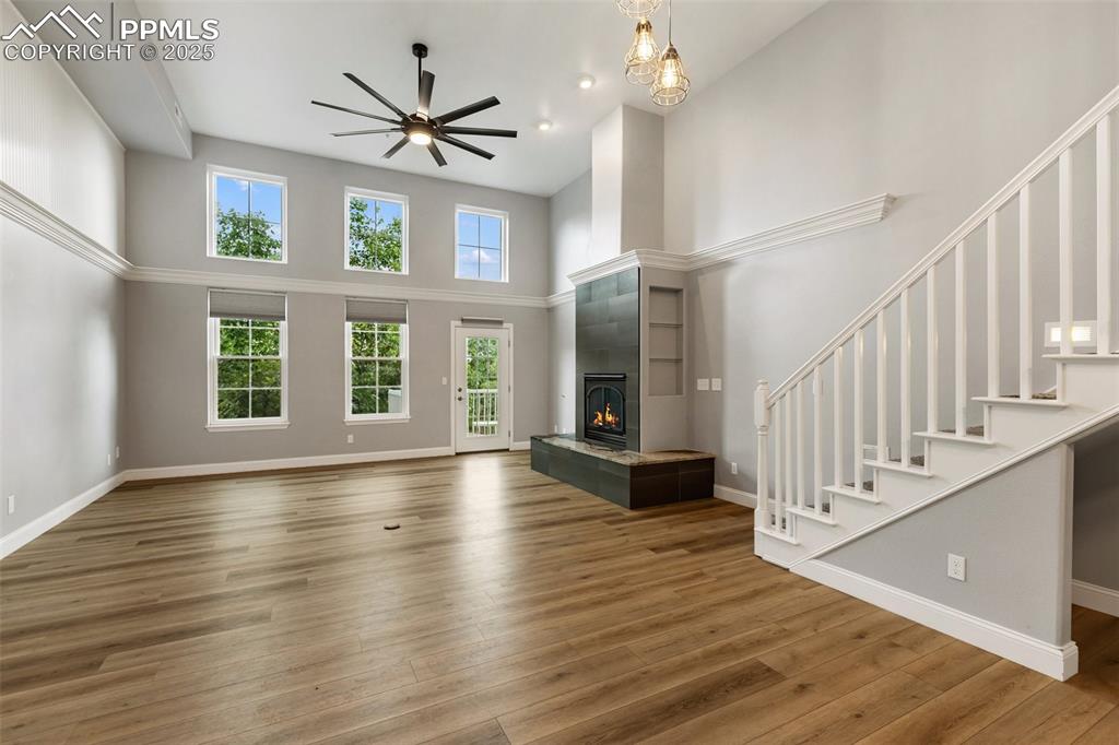 Image 10 of 44: Upper unit - first level with Soaring ceilings greet you. Windows feature a
