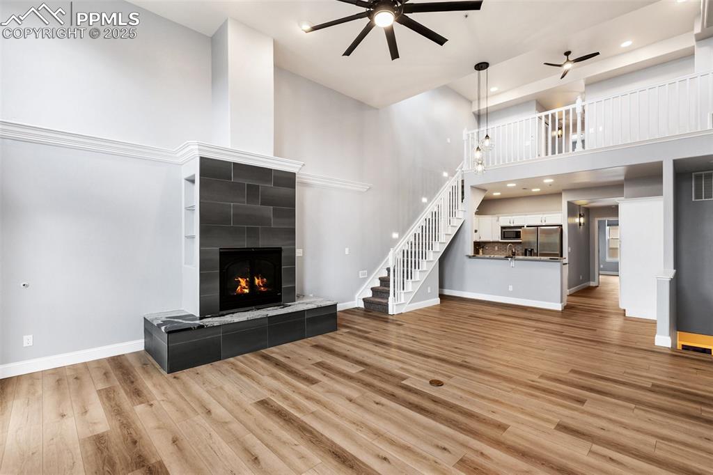 Image 11 of 44: Upper unit - Great room with loft overlooking