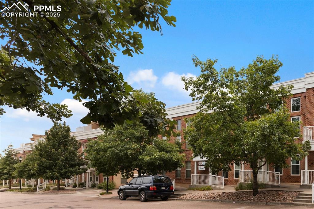 Image 2 of 44: View of building exterior from park