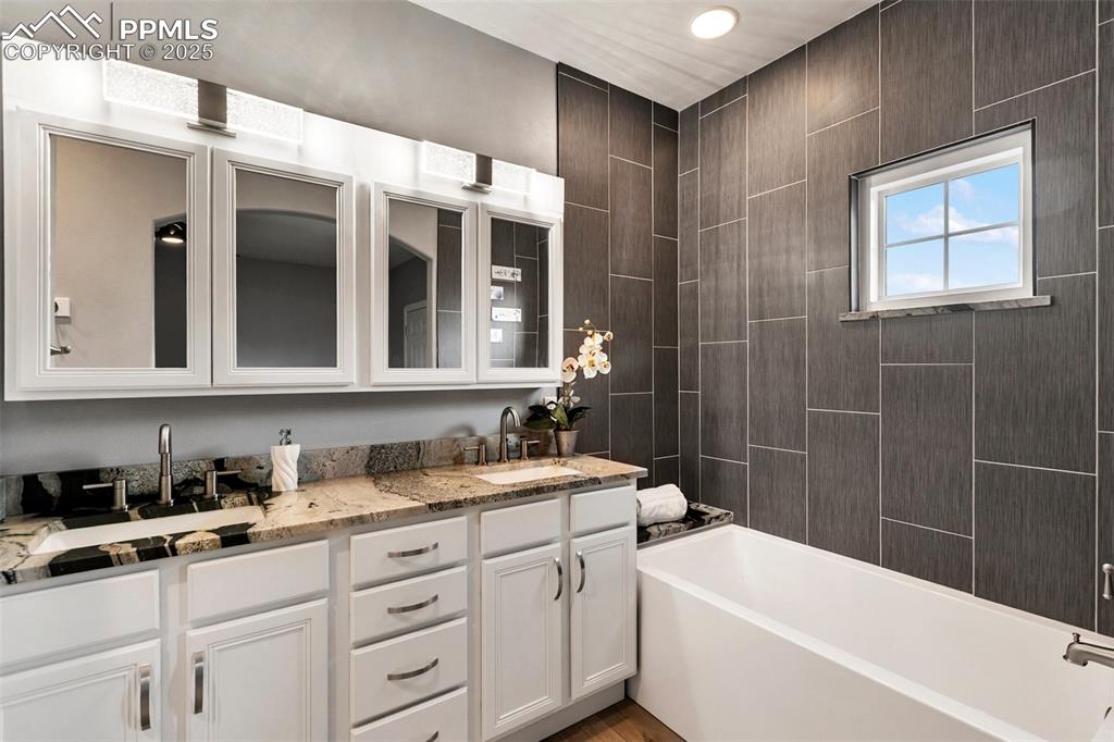 Image 20 of 44: First level of upper unit - Remodeled 5-piece primary bath with soaker tub