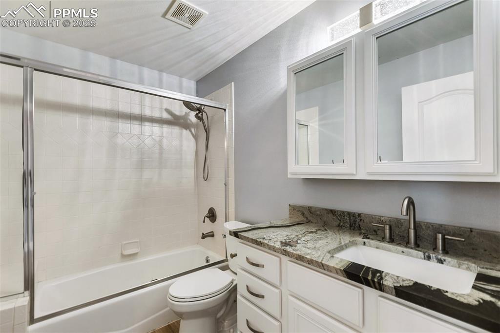 Image 34 of 44: Upstairs in upper unit Full bath with bath / shower combo