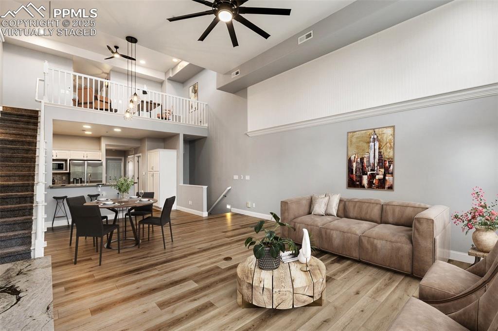Image 4 of 44: Upper unit great room on first level with open concept Virtually Staged