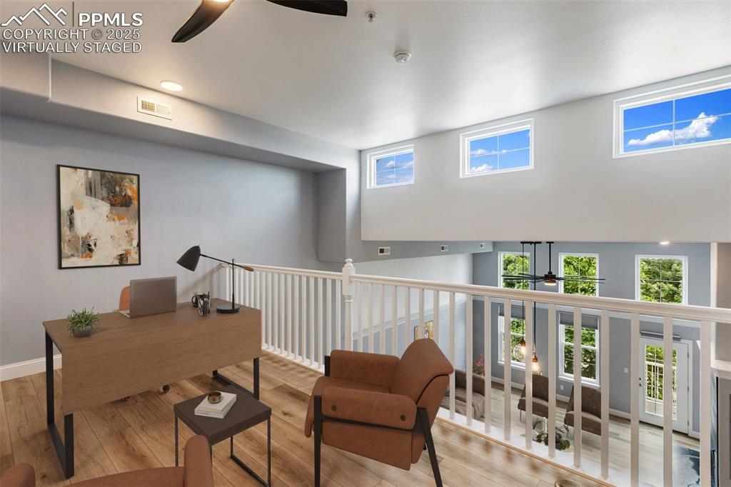 Image 5 of 44: Loft of upper unit is perfect for a home office, workout or media area. Vir