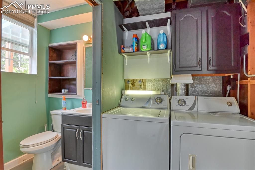 Image 19 of 37: Laundry room featuring washer and dryer