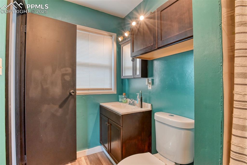 Image 25 of 37: Bathroom featuring vanity and wood finished floors