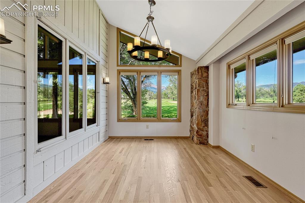 Image 16 of 49: Separate Eating Nook Room off the Kitchen with Pikes Peak & Golf Course Vie