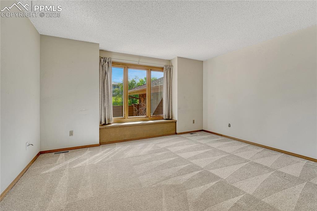 Image 20 of 49: 2nd Main Level Bedroom with Ensuite Full Bath
