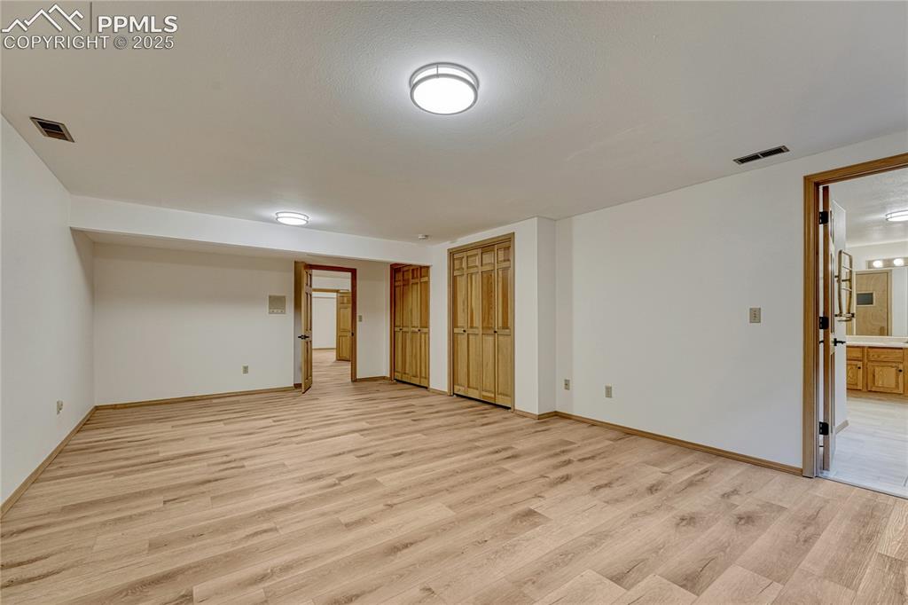 Image 30 of 49: Large 3rd Bedroom, All New LVT Floors, New LED Light Fixtures, New Paint, A