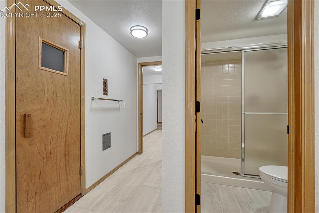 Image 32 of 49: Guest or Adjoining Bath with Sauna