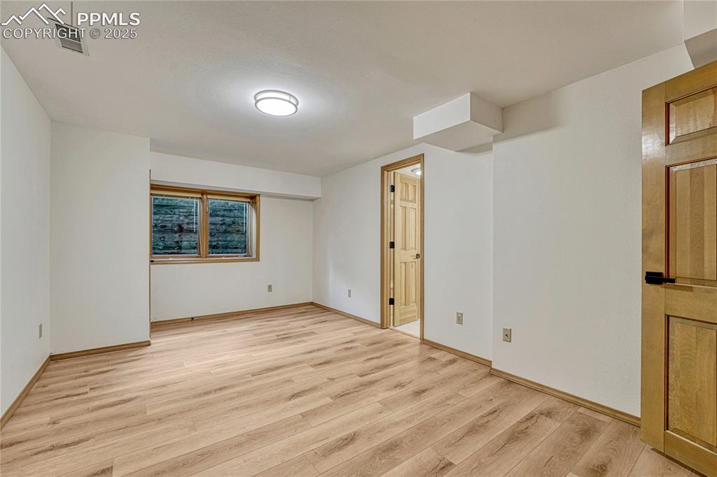 Image 34 of 49: 4th Bedroom, All New LVT Floors, New LED Light Fixtures, New Paint, Ensuite