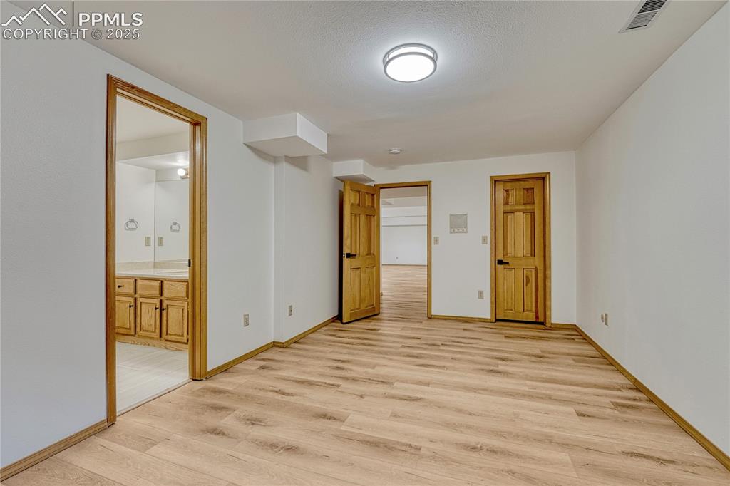 Image 35 of 49: 4th Bedroom, All New LVT Floors, New LED Light Fixtures, New Paint, Ensuite
