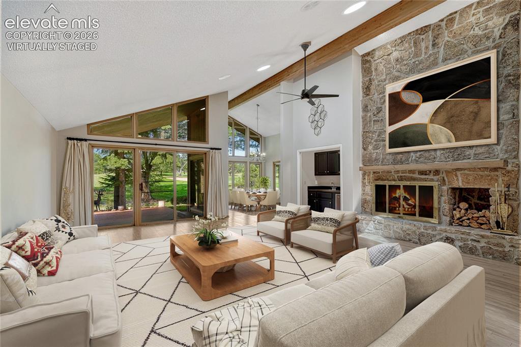 Image 4 of 49: "Virtually Staged" Vaulted Ceilings, Large Moss Rock Stone Fireplace