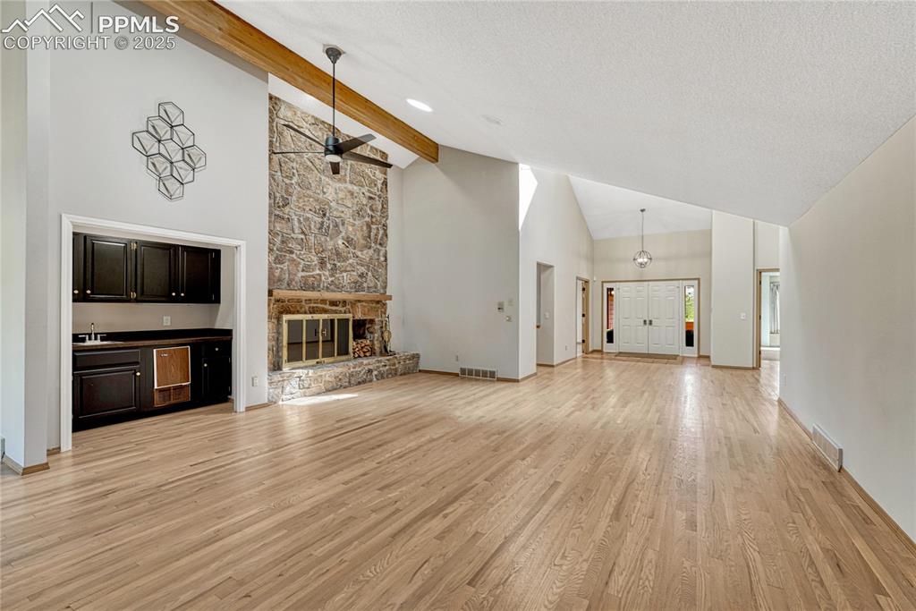Image 41 of 49: Vaulted with Wood Beam, Hardwood Floors, Wet Bar