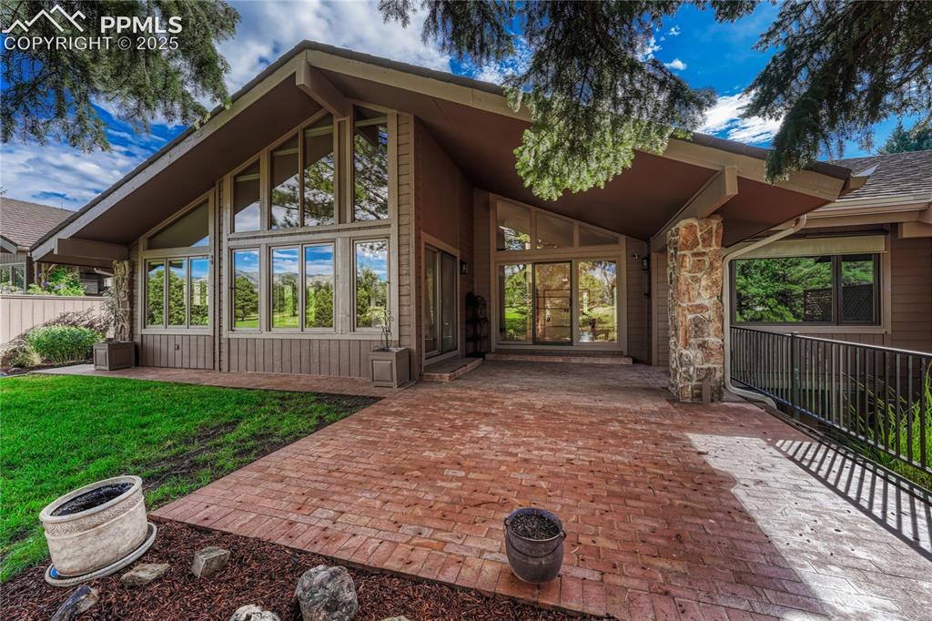 Image 47 of 49: Large Partially Covered Paver Patio with Views