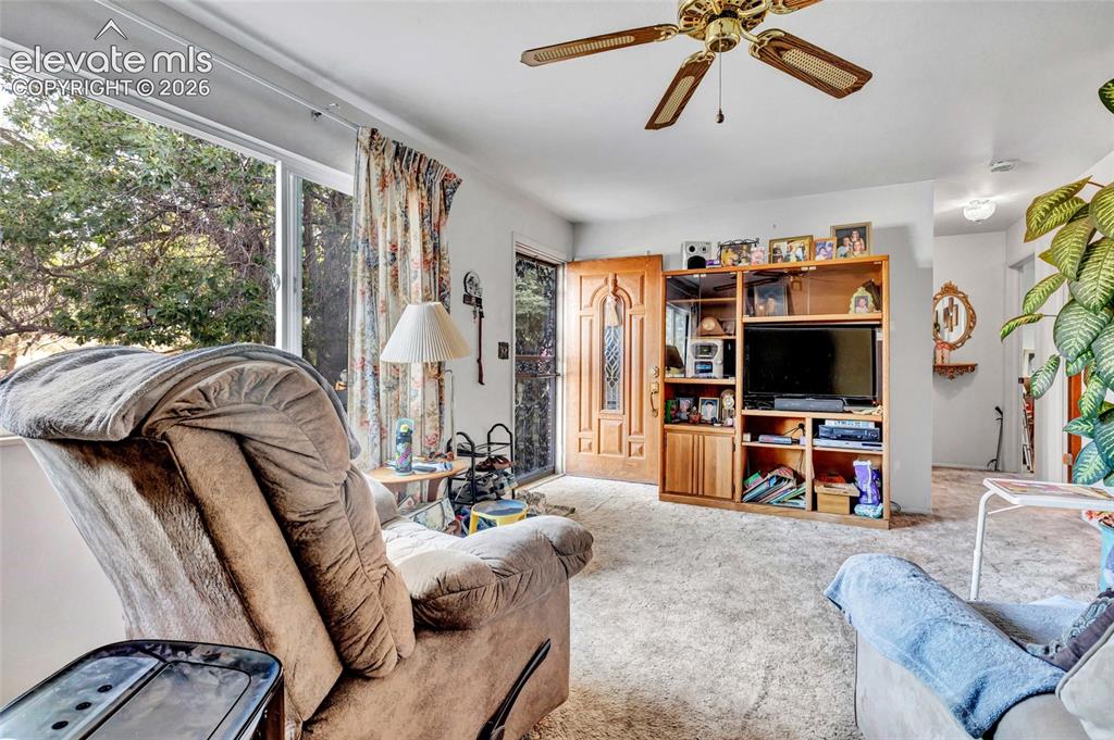 Image 8 of 26: Living room offers lots of natural light
