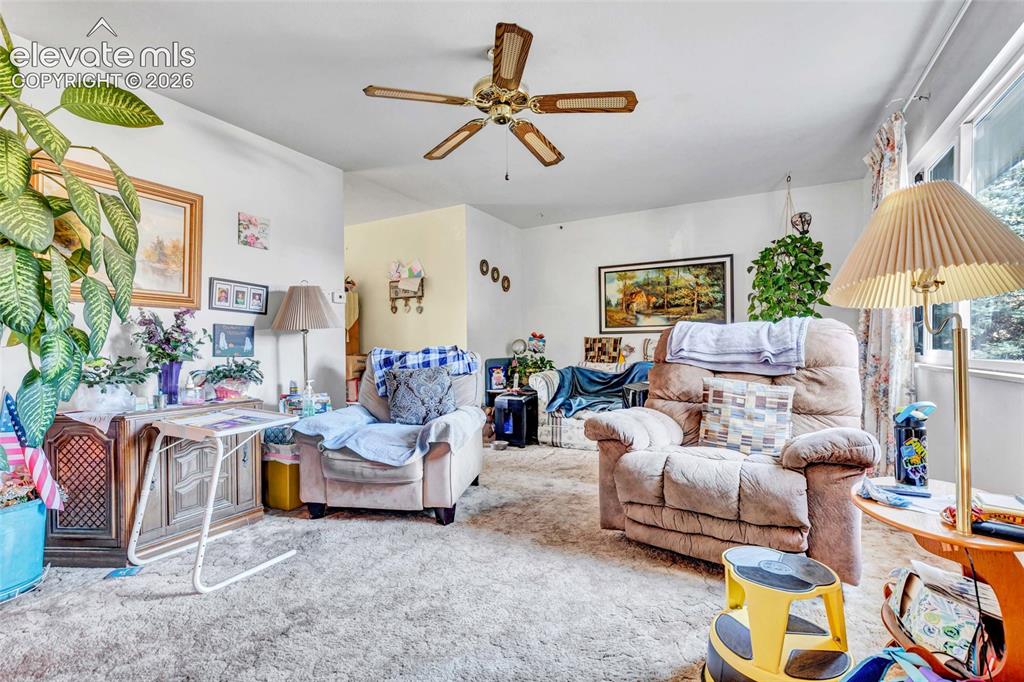 Image 9 of 26: Living rom has ceiling fan