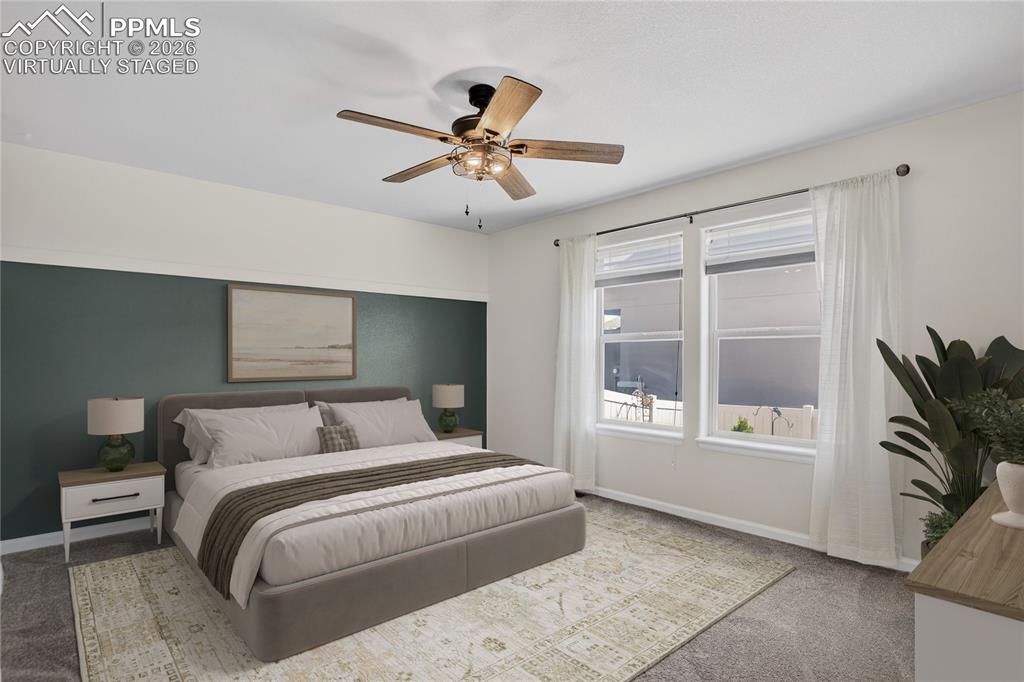 Image 18 of 50: Primary bedroom - virtually staged.