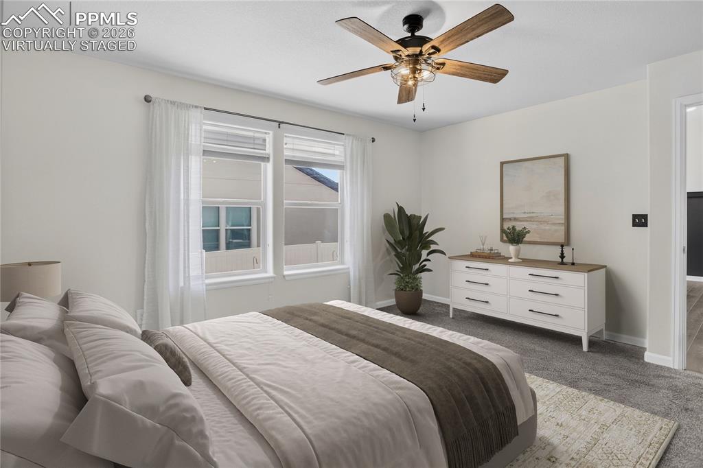 Image 20 of 50: Primary bedroom - virtually staged.
