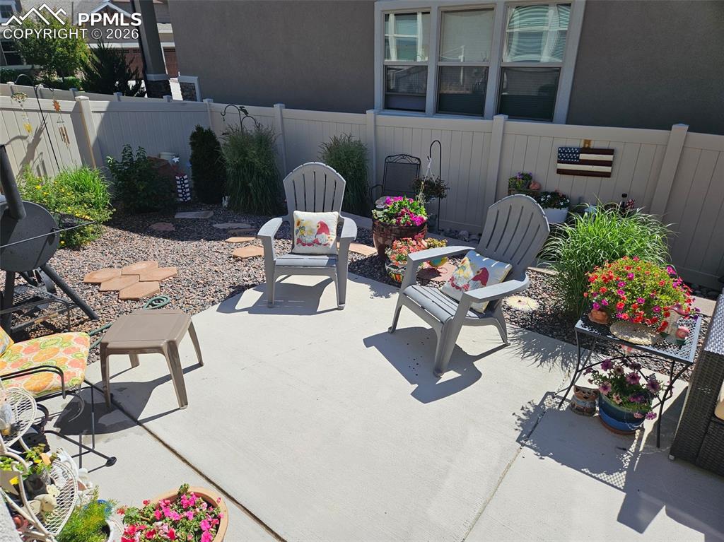 Image 48 of 50: Patio in summer.
