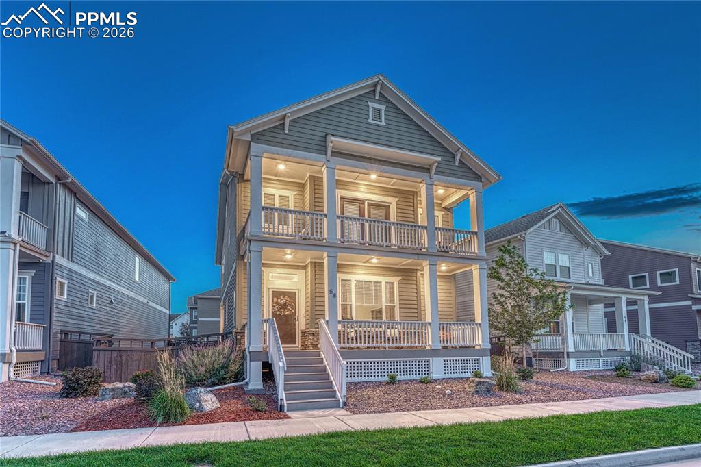 Caption: This Modern Craftsman/Neo-Colonial blend home with front porches in the Gold Hill Mesa community
