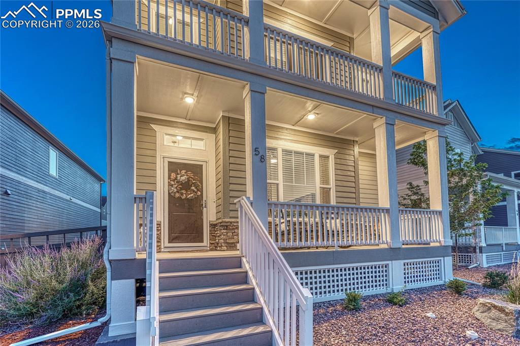 Image 2 of 50: Covered front porches look out and offer mountain and city views