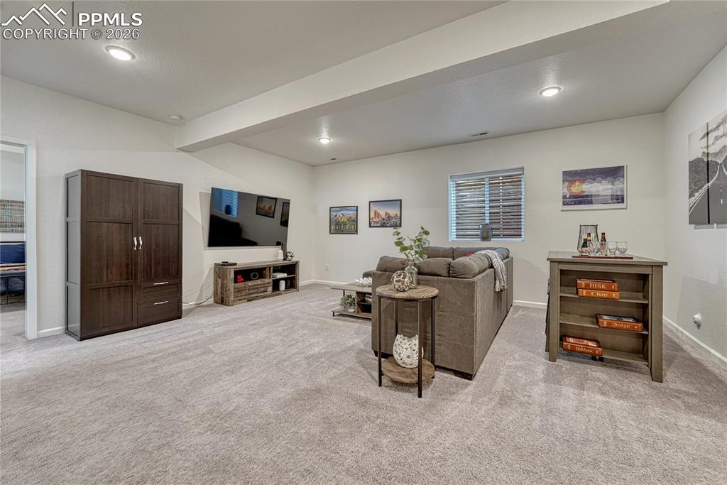 Image 36 of 50: Head downstairs to the finished basement where you find a large family/rec