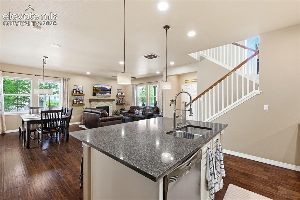 Image 21 of 46: Kitchen Open to Living Room and Dining Area