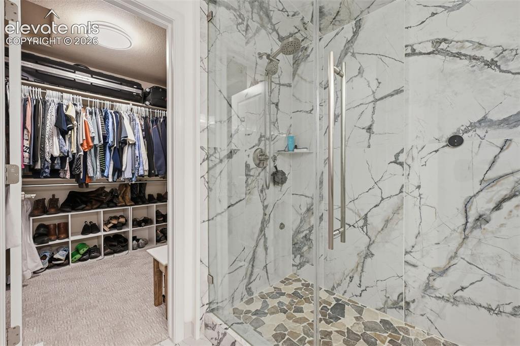 Image 31 of 46: Primary Bathroom with Walk In Closet