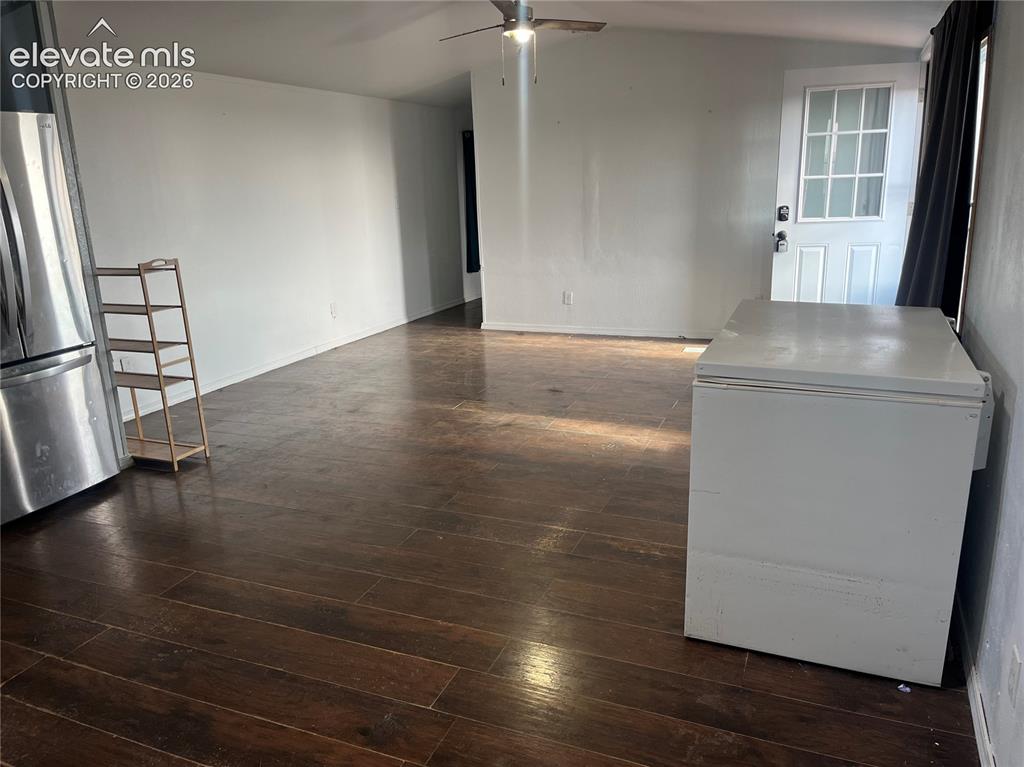 Image 10 of 14: Wood-finish flooring with white walls and a ceiling fan