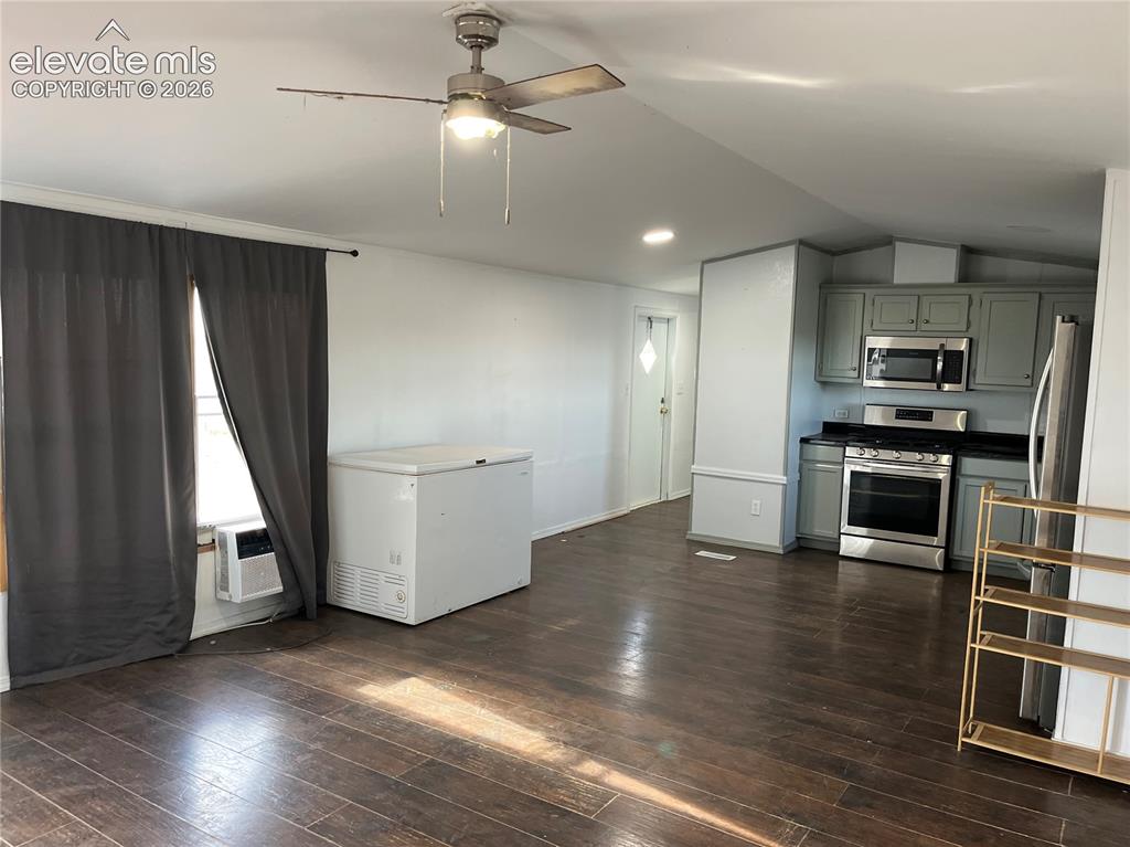 Image 8 of 14: Wood-finish flooring throughout the main living area