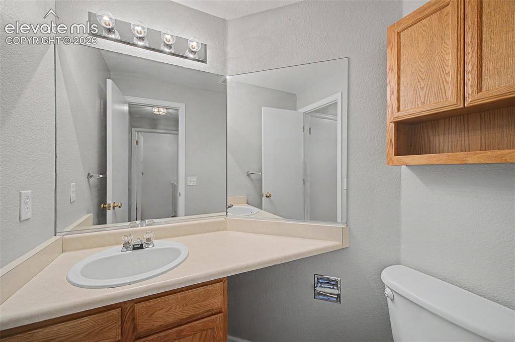 Image 10 of 17: Main level half bathroom