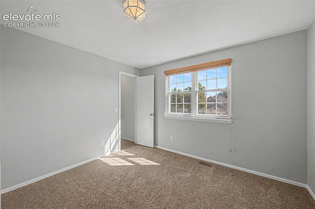 Image 14 of 17: 1 of 3 bedrooms
