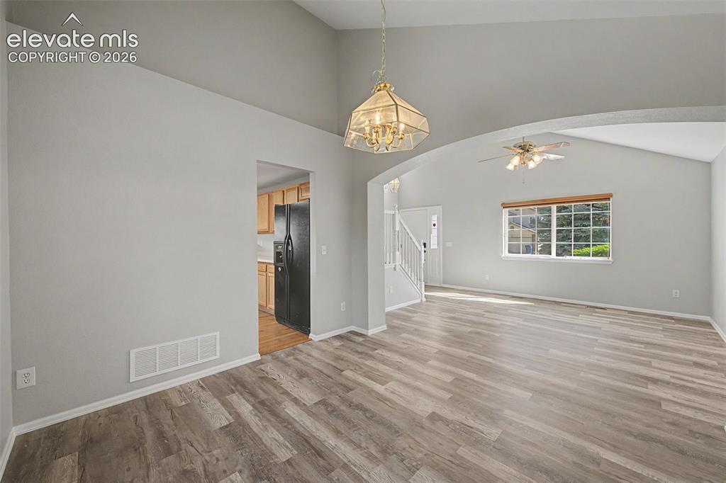 Image 9 of 17: Dining room, with luxury vinyl plank flooring 
