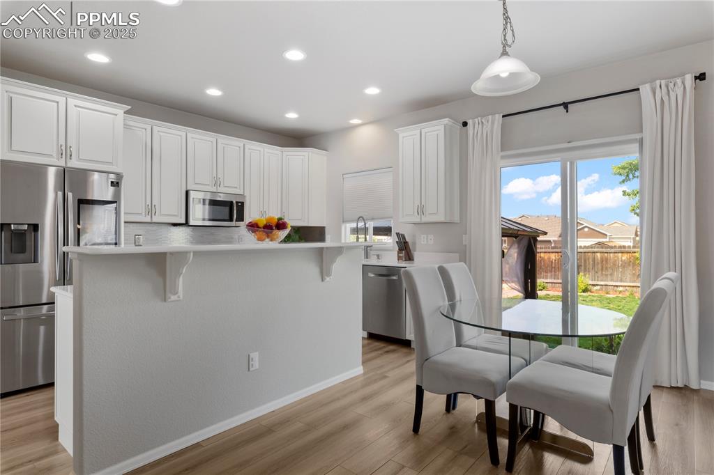 Image 14 of 43: Eat in kitchen walks out to the backyard!