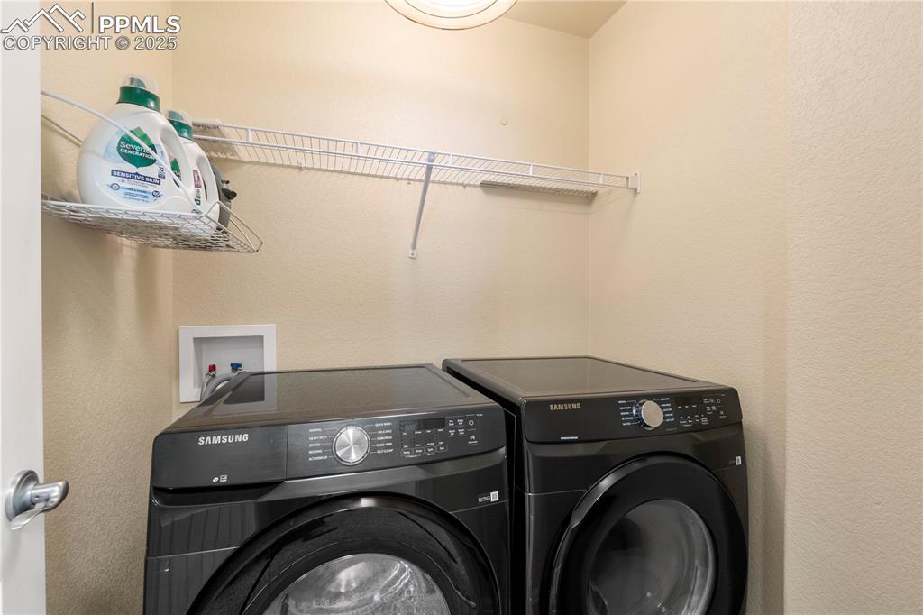 Image 26 of 43: Separate laundry room upstairs with the bedrooms!