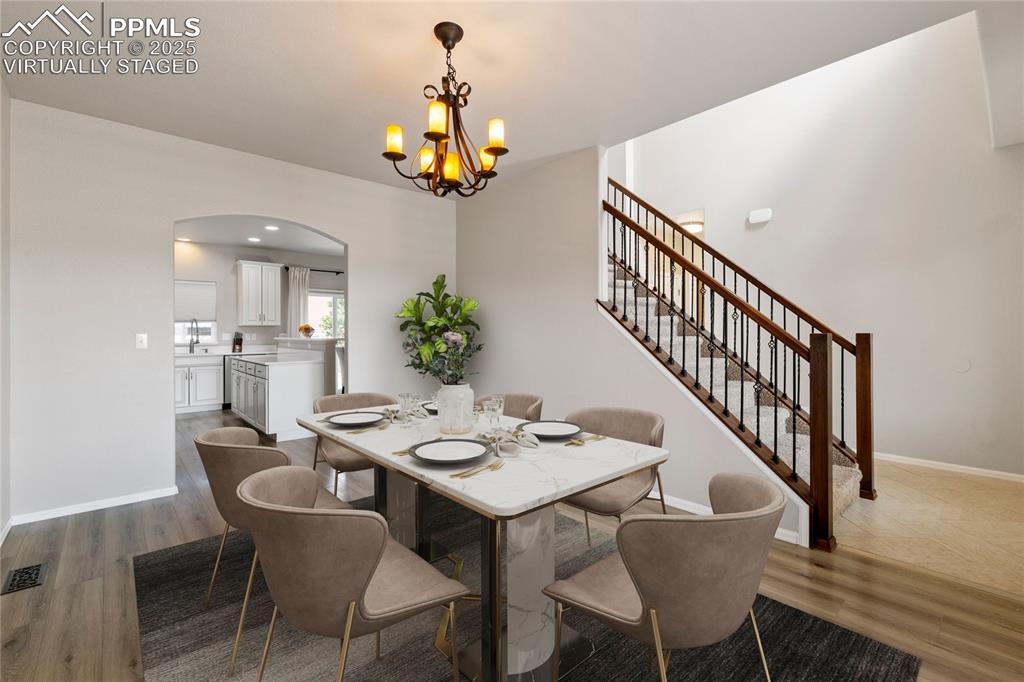 Image 7 of 43: Virtually staged picture of different view of formal dining room/2nd living