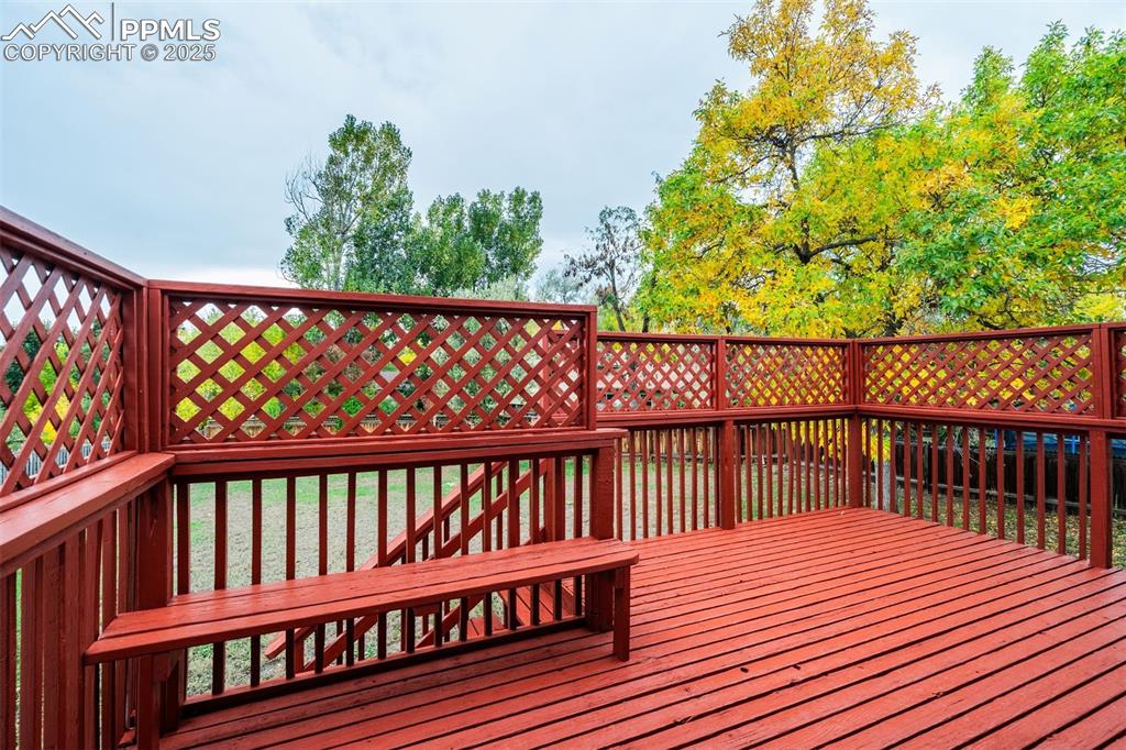 Image 12 of 44: Great deck with bench and railings
