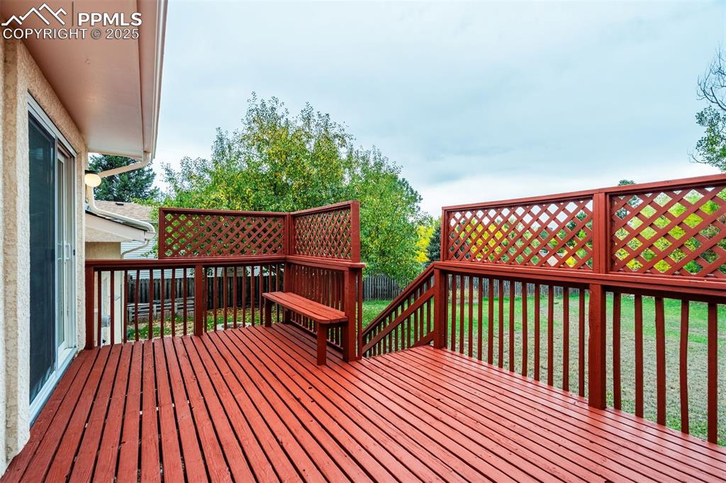 Image 13 of 44: Stairs down to rear yard