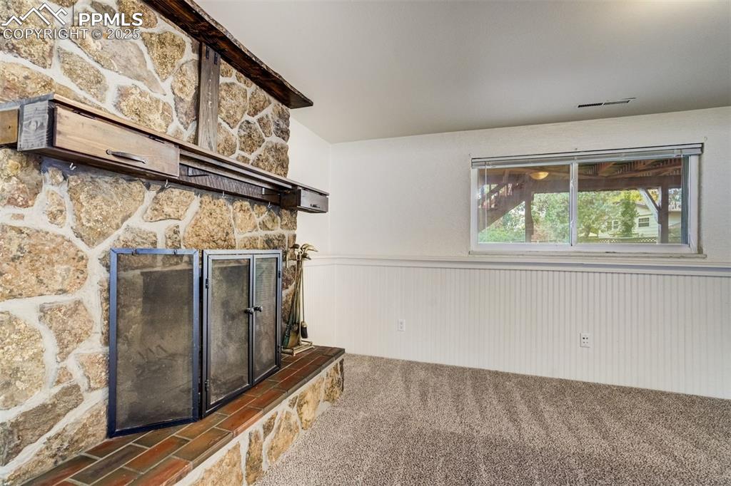 Image 23 of 44: Awesome wood burning fireplace in family room